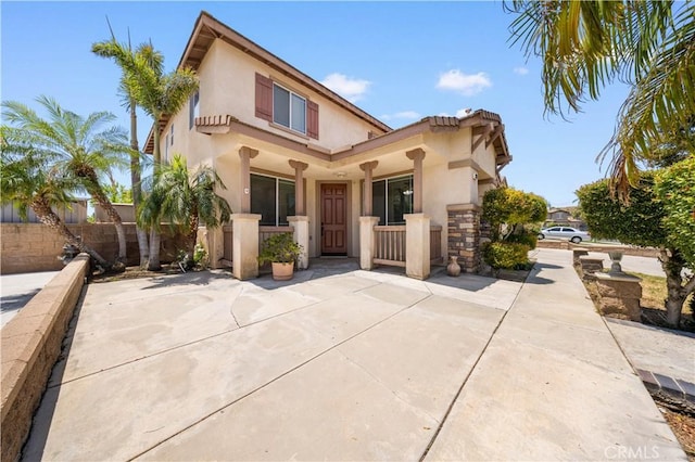 12337 Columbia Ln, Eastvale, CA 91752 - mediterranean / spanish-style home featuring stucco siding and a porch