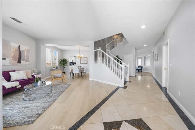 12337 Columbia Ln, Eastvale, CA 91752 - living room with stairs, a chandelier, light tile patterned flooring, inlaid floor details, and recessed lighting