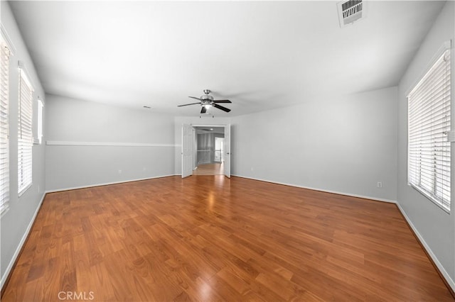 12337 Columbia Ln, Eastvale, CA 91752 - empty room featuring ceiling fan, wood finished floors, and plenty of natural light