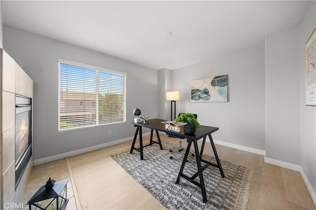 12337 Columbia Ln, Eastvale, CA 91752 - office area featuring light wood-type flooring and baseboards