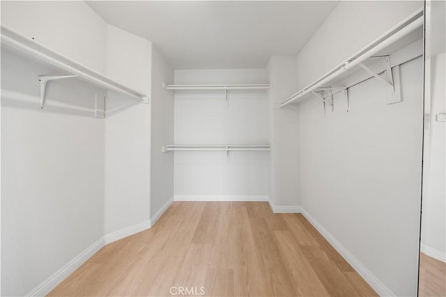 12337 Columbia Ln, Eastvale, CA 91752 - spacious closet featuring wood finished floors