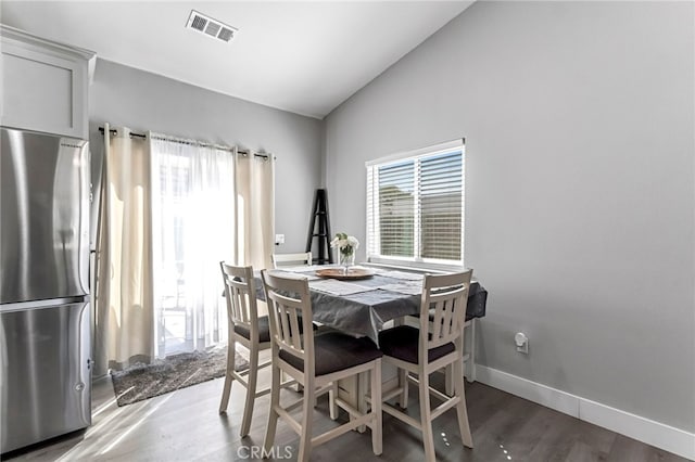 22375 Fairmead Cir, Chowchilla, CA 93610 - dining room featuring wood finished floors and lofted ceiling