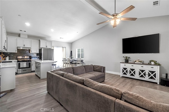 22375 Fairmead Cir, Chowchilla, CA 93610 - living area featuring light wood-style floors, a ceiling fan, high vaulted ceiling, and recessed lighting