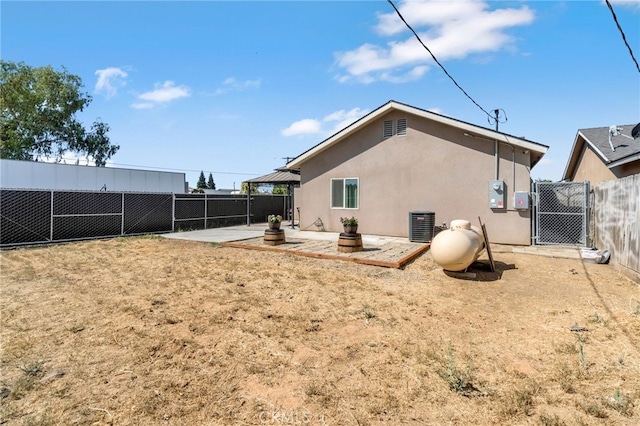 22375 Fairmead Cir, Chowchilla, CA 93610 - rear view of property featuring a patio area, stucco siding, a fenced backyard, and a gazebo