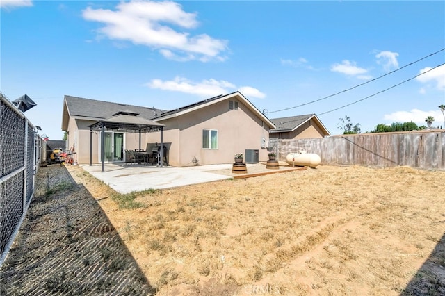 22375 Fairmead Cir, Chowchilla, CA 93610 - rear view of house featuring a gazebo, stucco siding, a fenced backyard, and a patio area