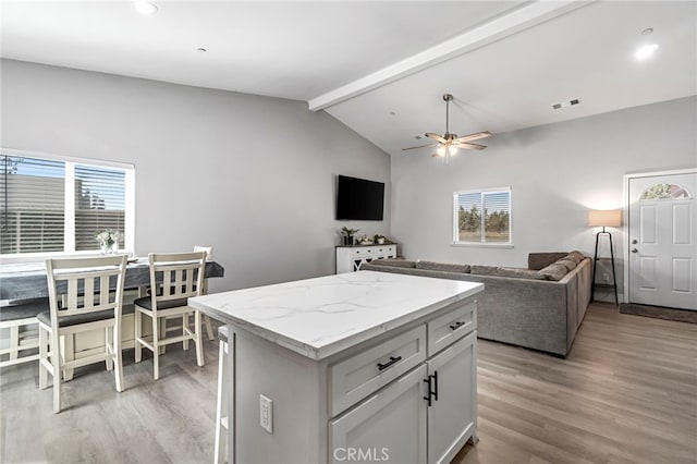 22375 Fairmead Cir, Chowchilla, CA 93610 - kitchen with open floor plan, light wood-style flooring, ceiling fan, a center island, and recessed lighting