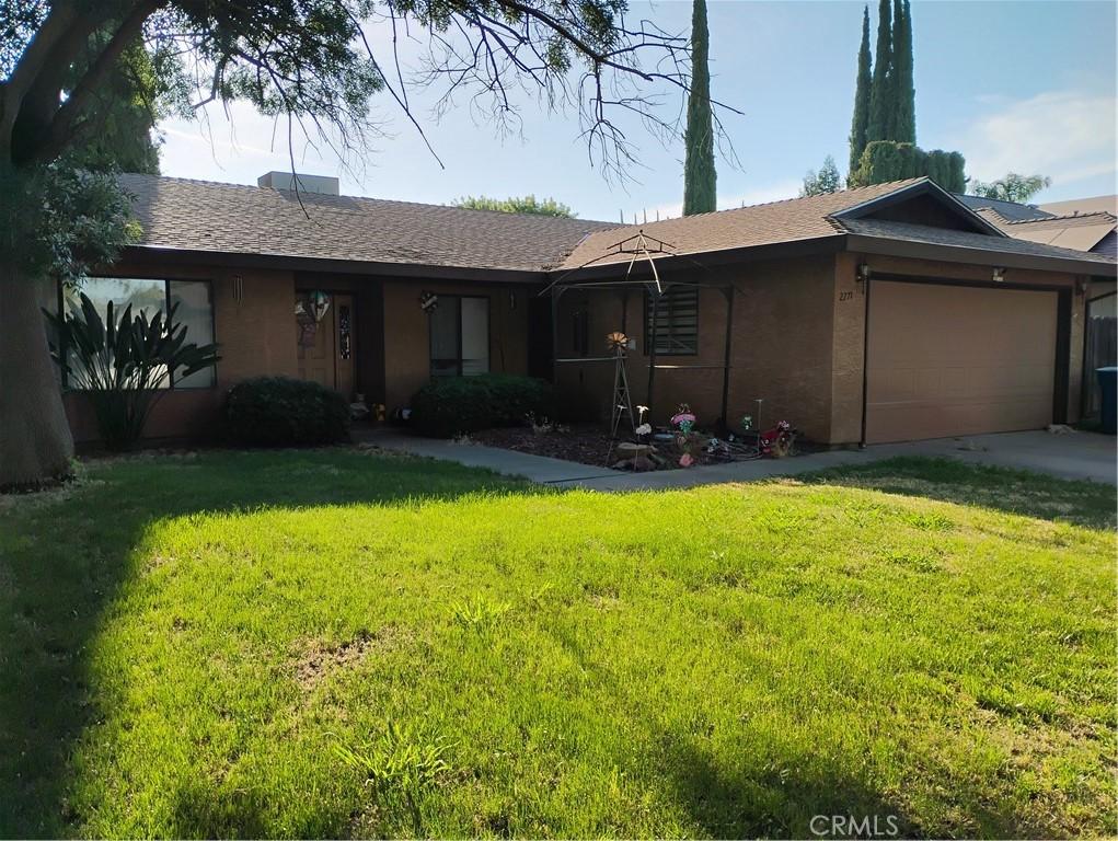 2771 Saratoga Ave, Merced, CA 95340 - ranch-style house featuring a front yard, a garage, and concrete driveway