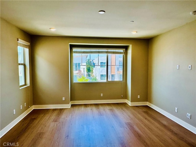 158 Scale, Irvine, CA 92618 - unfurnished room featuring dark wood-style floors and a smoke detector