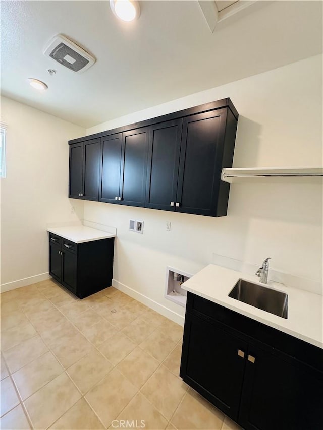 158 Scale, Irvine, CA 92618 - laundry room featuring cabinet space, hookup for a washing machine, and light tile patterned flooring