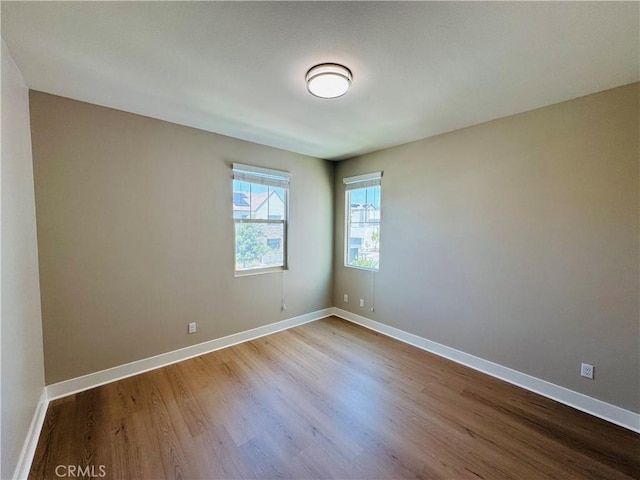 158 Scale, Irvine, CA 92618 - unfurnished room with dark wood-style floors and baseboards