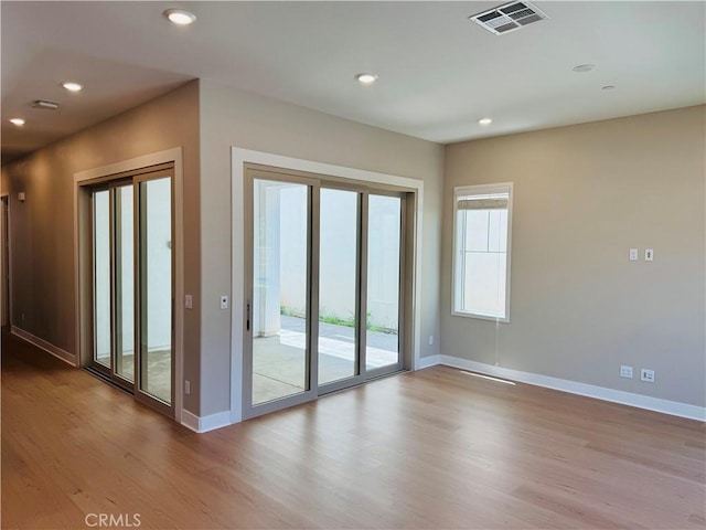 158 Scale, Irvine, CA 92618 - spare room featuring wood finished floors and recessed lighting