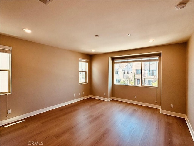 158 Scale, Irvine, CA 92618 - unfurnished room with dark wood-style floors, a smoke detector, and recessed lighting