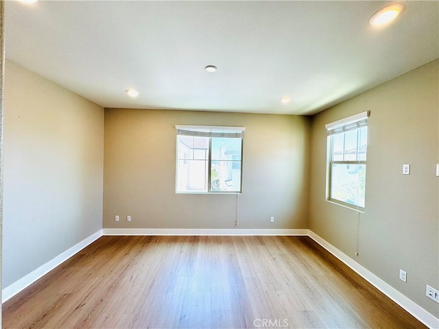 158 Scale, Irvine, CA 92618 - empty room featuring wood finished floors, plenty of natural light, and recessed lighting