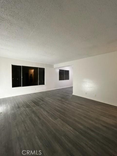 1600 Picadilly Way, Fullerton, CA 92833 - unfurnished room with dark wood finished floors, a textured ceiling, and baseboards