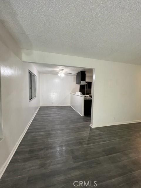 1600 Picadilly Way, Fullerton, CA 92833 - unfurnished living room featuring baseboards, a textured ceiling, and dark wood-style floors