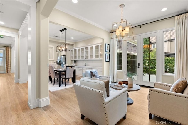 37 Craftsbury Pl, Ladera Ranch, CA 92694 - living room featuring a chandelier, ornamental molding, light wood-style floors, and recessed lighting