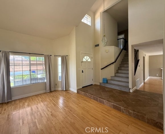 27745 Desert Pl, Castaic, CA 91384 - entrance foyer featuring a high ceiling, wood-type flooring, and stairway