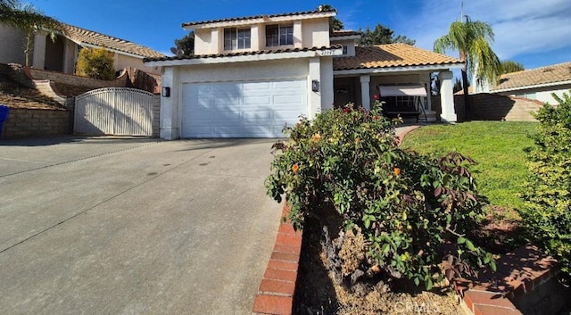 27745 Desert Pl, Castaic, CA 91384 - view of front facade with driveway, a gate, stucco siding, an attached garage, and a tiled roof