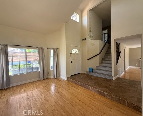 27745 Desert Pl, Castaic, CA 91384 - entrance foyer with a high ceiling, hardwood / wood-style floors, and stairs