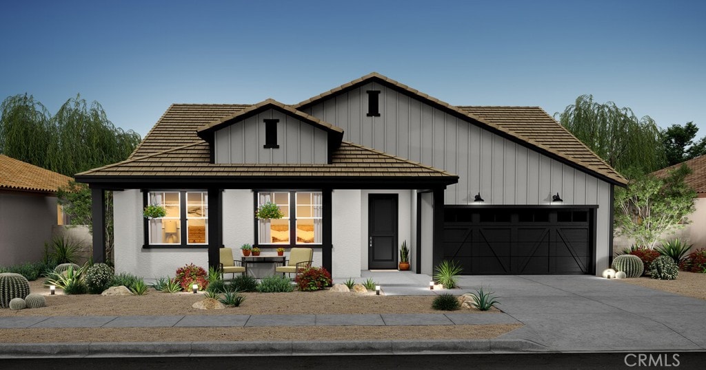 45048 W View Dr, Lancaster, CA 93536 - modern farmhouse style home with board and batten siding, an attached garage, driveway, and a porch