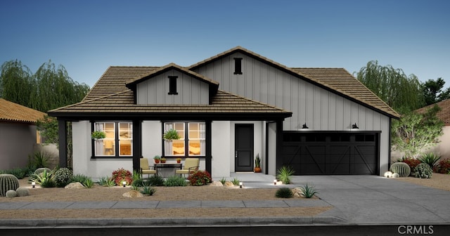 45048 W View Dr, Lancaster, CA 93536 - modern farmhouse style home with board and batten siding, an attached garage, driveway, and a porch