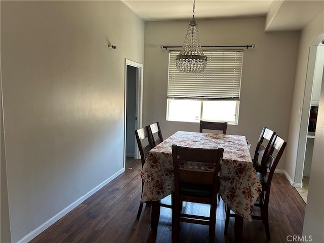 5825 Sky Lakes Ave, Bakersfield, CA 93313 - dining space with a chandelier and dark wood-style floors