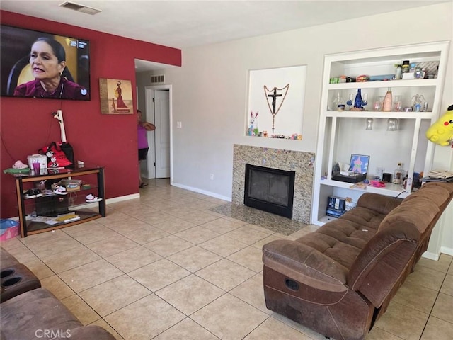 5825 Sky Lakes Ave, Bakersfield, CA 93313 - tiled living room with built in features and a fireplace