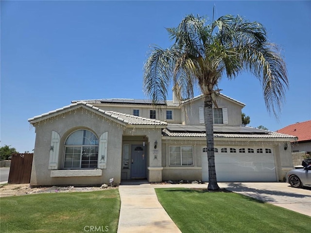 5825 Sky Lakes Ave, Bakersfield, CA 93313 - view of front of home with roof mounted solar panels, driveway, stucco siding, a tiled roof, and a garage