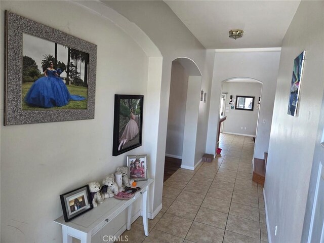 5825 Sky Lakes Ave, Bakersfield, CA 93313 - hallway featuring arched walkways and light tile patterned flooring