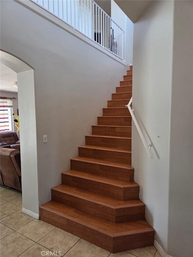 5825 Sky Lakes Ave, Bakersfield, CA 93313 - staircase featuring arched walkways and tile patterned flooring