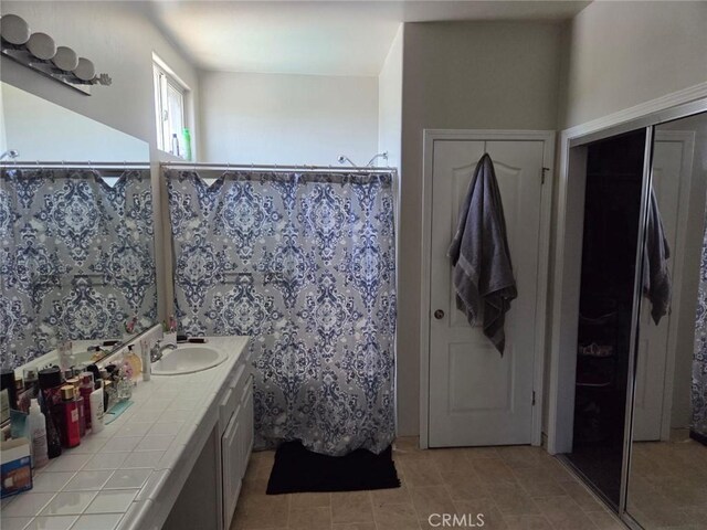 5825 Sky Lakes Ave, Bakersfield, CA 93313 - full bathroom featuring vanity and curtained shower