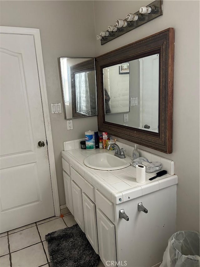 5825 Sky Lakes Ave, Bakersfield, CA 93313 - bathroom with vanity and tile patterned flooring