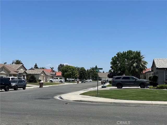 5825 Sky Lakes Ave, Bakersfield, CA 93313 - view of asphalt street with a residential view, curbs, and sidewalks