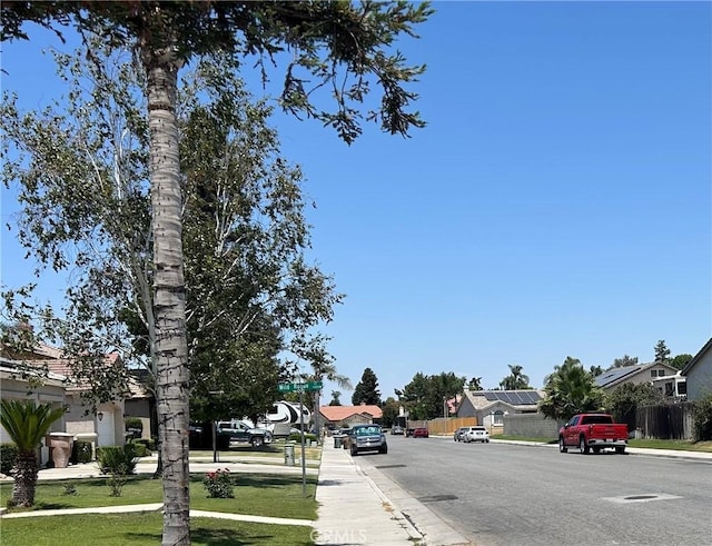 5825 Sky Lakes Ave, Bakersfield, CA 93313 - view of asphalt street featuring curbs, sidewalks, and a residential view