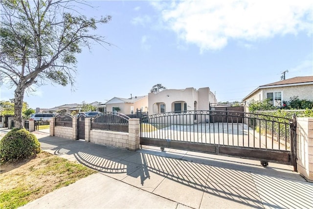921 N Brand Blvd, San Fernando, CA 91340 - mediterranean / spanish house with a fenced front yard, a residential view, stucco siding, and a gate