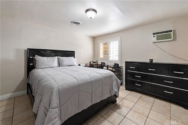 921 N Brand Blvd, San Fernando, CA 91340 - bedroom with an AC wall unit and light tile patterned floors
