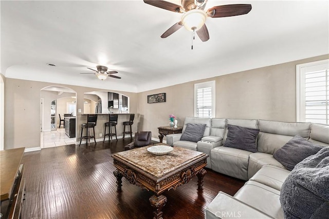 921 N Brand Blvd, San Fernando, CA 91340 - living room featuring a ceiling fan, arched walkways, plenty of natural light, and wood-type flooring