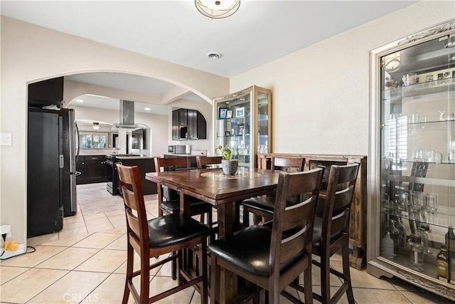 921 N Brand Blvd, San Fernando, CA 91340 - dining room with arched walkways and light tile patterned flooring