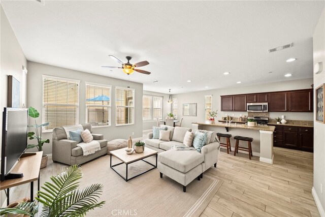 46059 Rocky Trail Ln Unit 124, Temecula, CA 92592 - living room with light wood-style floors, a ceiling fan, and recessed lighting