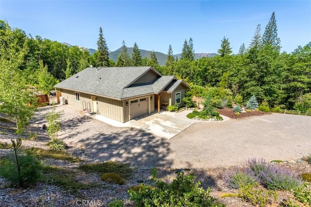 9116 Rocky Rd, Weed, CA 96094 - view of front facade featuring an attached garage, driveway, and a mountain view