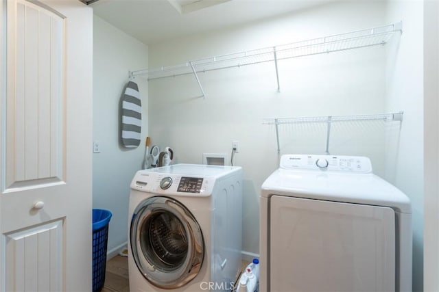 9116 Rocky Rd, Weed, CA 96094 - washroom featuring washer and clothes dryer and wood finished floors
