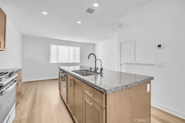 332 Gelding Way, Rancho Mission Viejo, CA 92694 - kitchen with range, light wood finished floors, light stone countertops, a kitchen island with sink, and recessed lighting