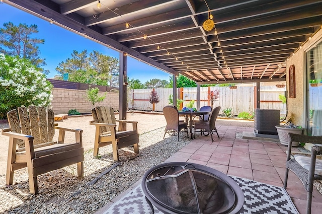 2846 Nandina Dr, Palmdale, CA 93550 - fenced backyard featuring a fire pit, a patio area, and outdoor dining area