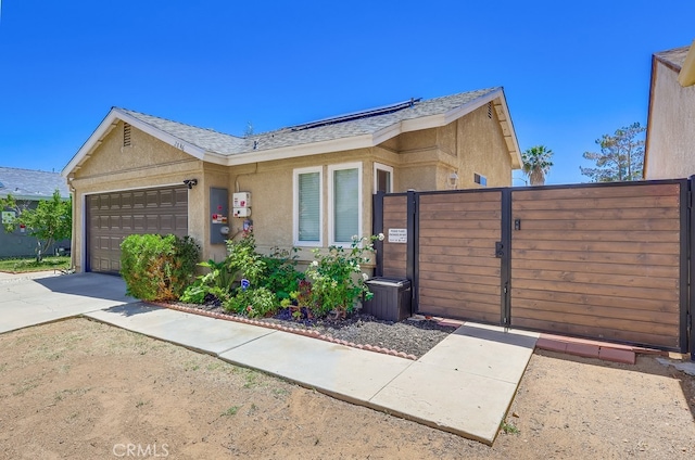 2846 Nandina Dr, Palmdale, CA 93550 - view of front of property with a garage, a gate, a shingled roof, stucco siding, and concrete driveway
