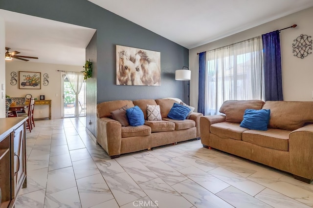 2846 Nandina Dr, Palmdale, CA 93550 - living area featuring light marble finish flooring, vaulted ceiling, and a ceiling fan