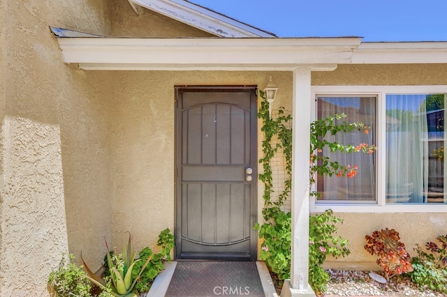 2846 Nandina Dr, Palmdale, CA 93550 - view of exterior entry featuring stucco siding