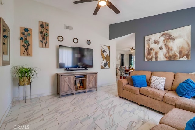 2846 Nandina Dr, Palmdale, CA 93550 - living area with ceiling fan, light marble finish floors, baseboards, and lofted ceiling