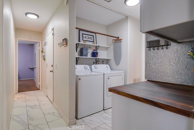 2846 Nandina Dr, Palmdale, CA 93550 - washroom featuring washer and dryer, light marble finish flooring, and baseboards
