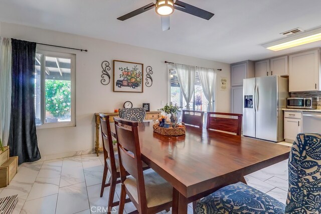 2846 Nandina Dr, Palmdale, CA 93550 - dining space featuring light marble finish flooring and ceiling fan