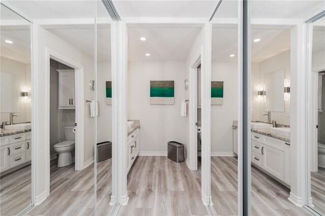 27705 Calle Valdes, Mission Viejo, CA 92692 - bathroom with two vanities, wood finished floors, and recessed lighting